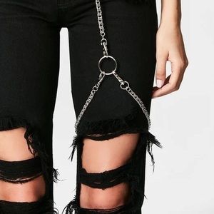 Black denim ripped LF jeans w metallic thigh strap detail. So unique. Sold out